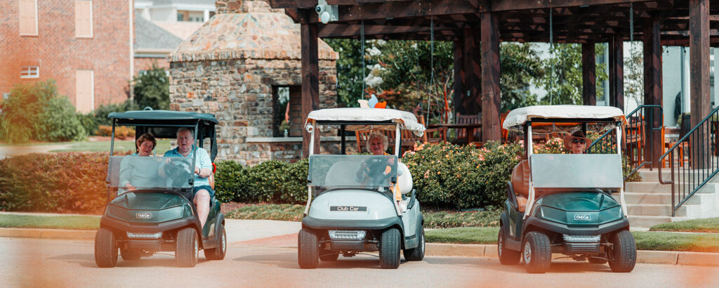 Golf carts are used by residents to travers campus