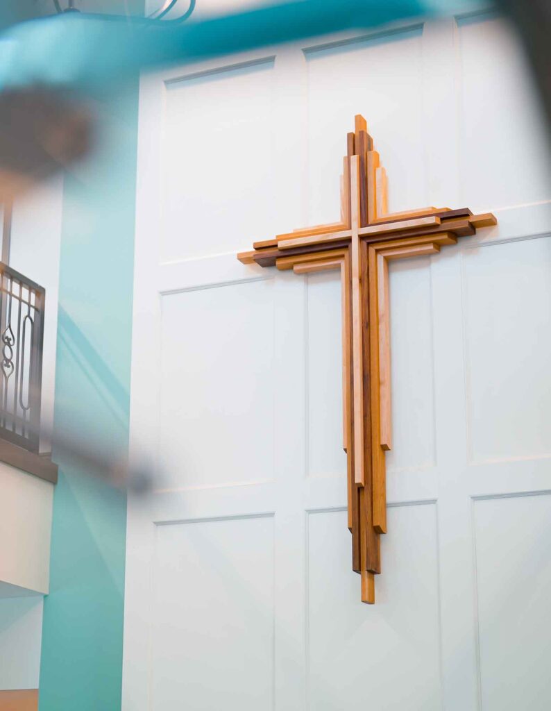The interior of the lobby of the Jordan River Health Campus features a modern wooden cross