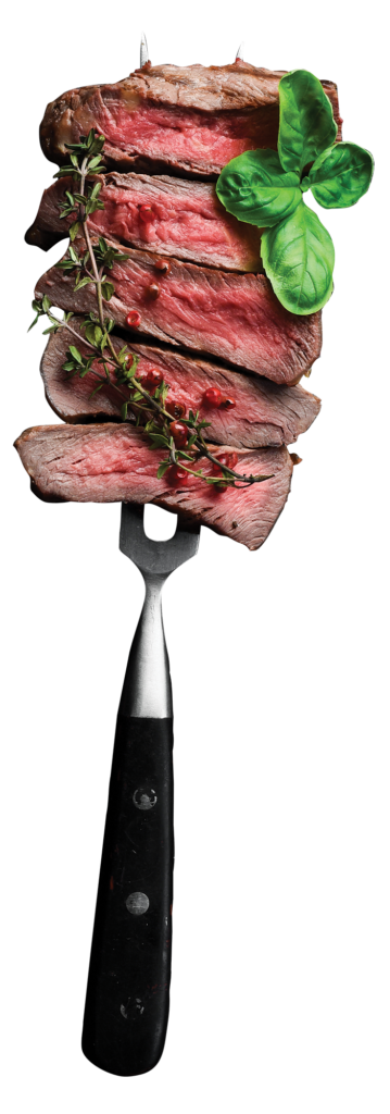 bites of steak stacked on a fork