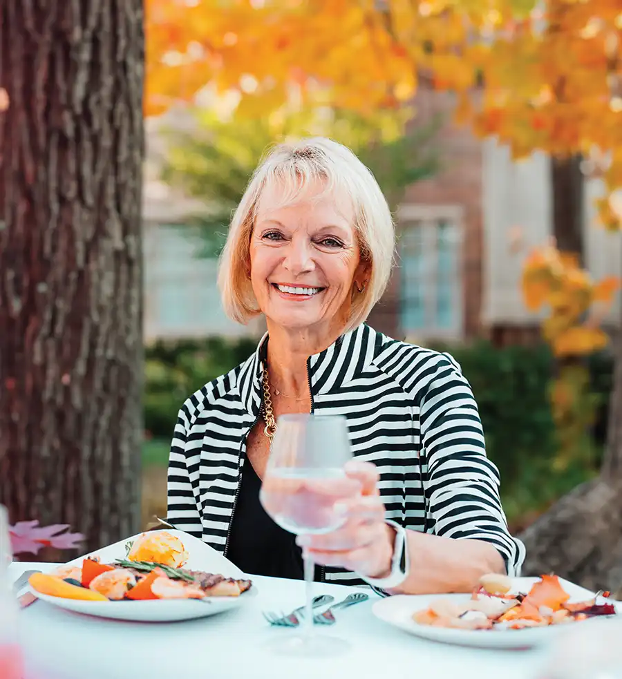 Woman dining outdoors in the fall