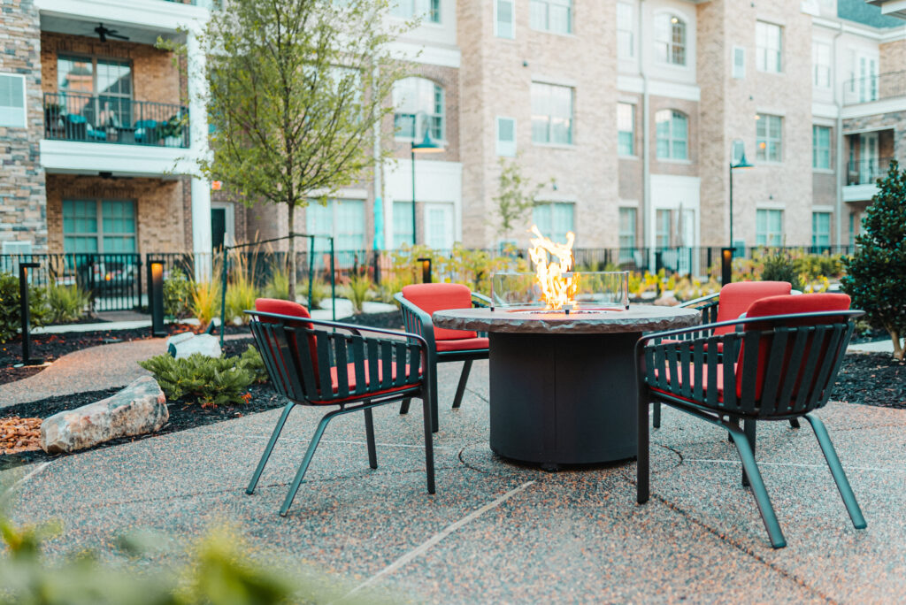 Outdoor fire pit with chairs in courtyard