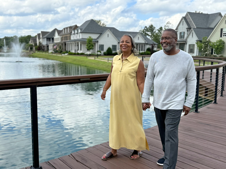 couple walking on a bridge