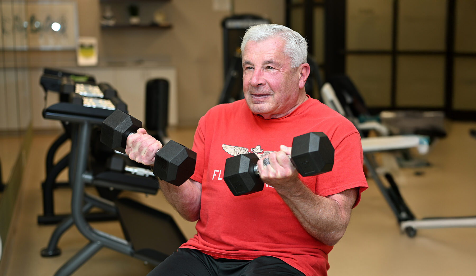 senior man doing curls