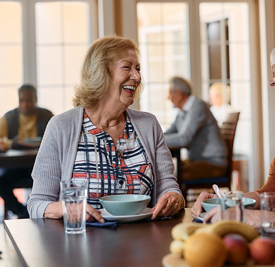 senior woman eating breakfsast
